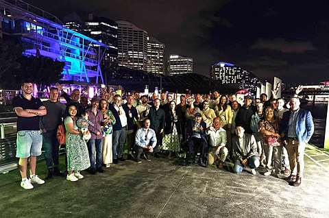 The full guest list gathered together on the waterfront at Darling Harbour at the end of the night.