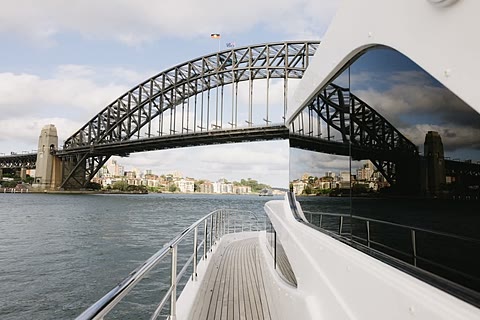 The Sydney Harbour Bridge seen from the bow of a charter boat.
