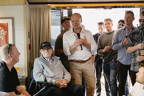 A speaker addressing guests during a milestone celebration.
